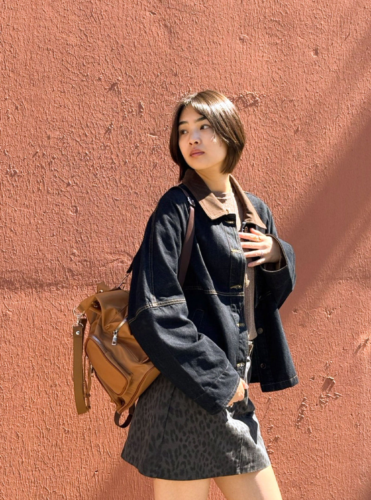 Brettnie caramel convertible backpack styled on a model