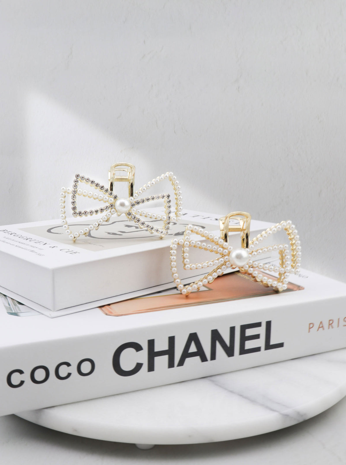 Jaice pearl bow hair claw in a styled setting