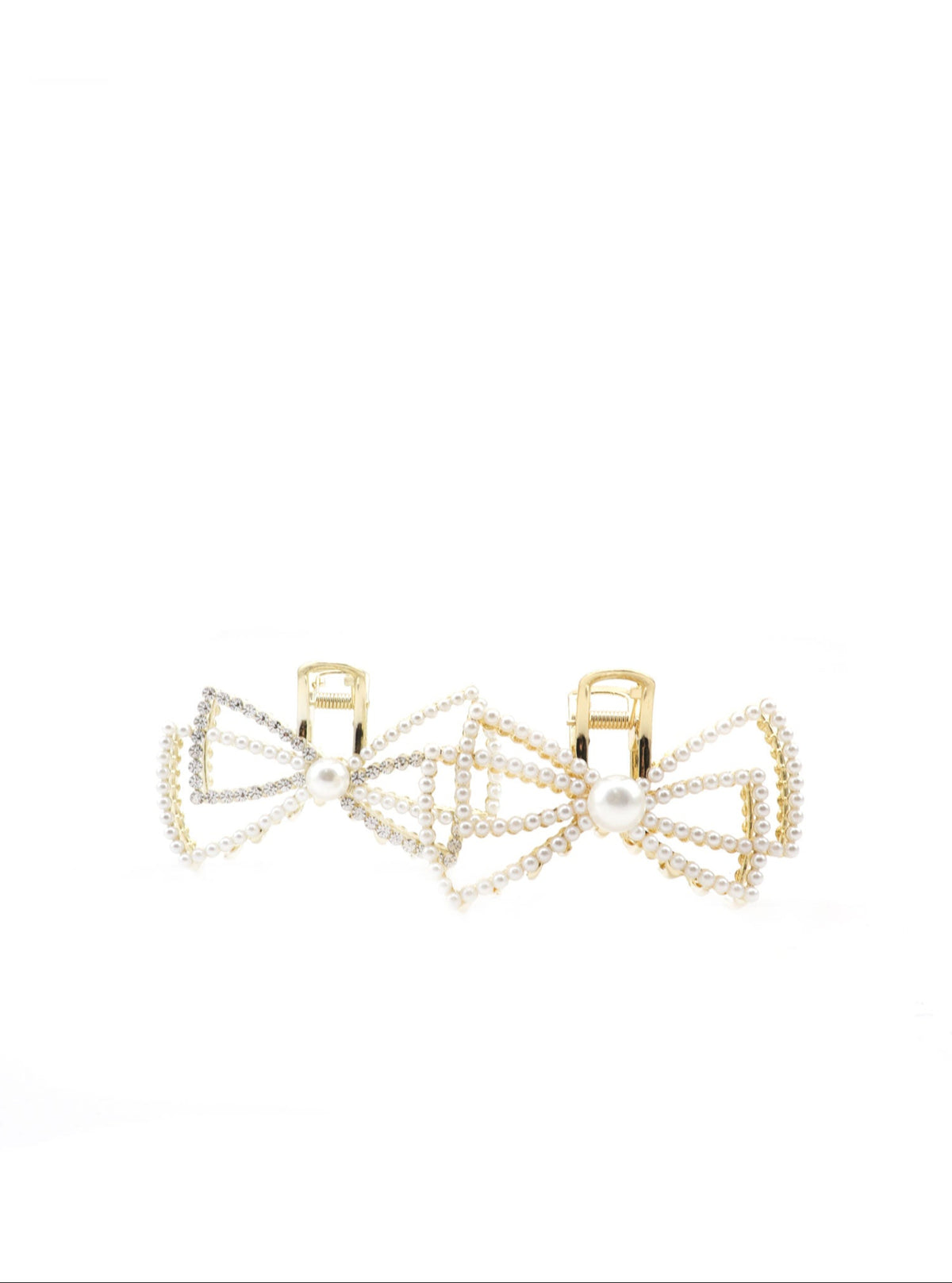 Detail view of Jaice pearl and cubic bow hair claw