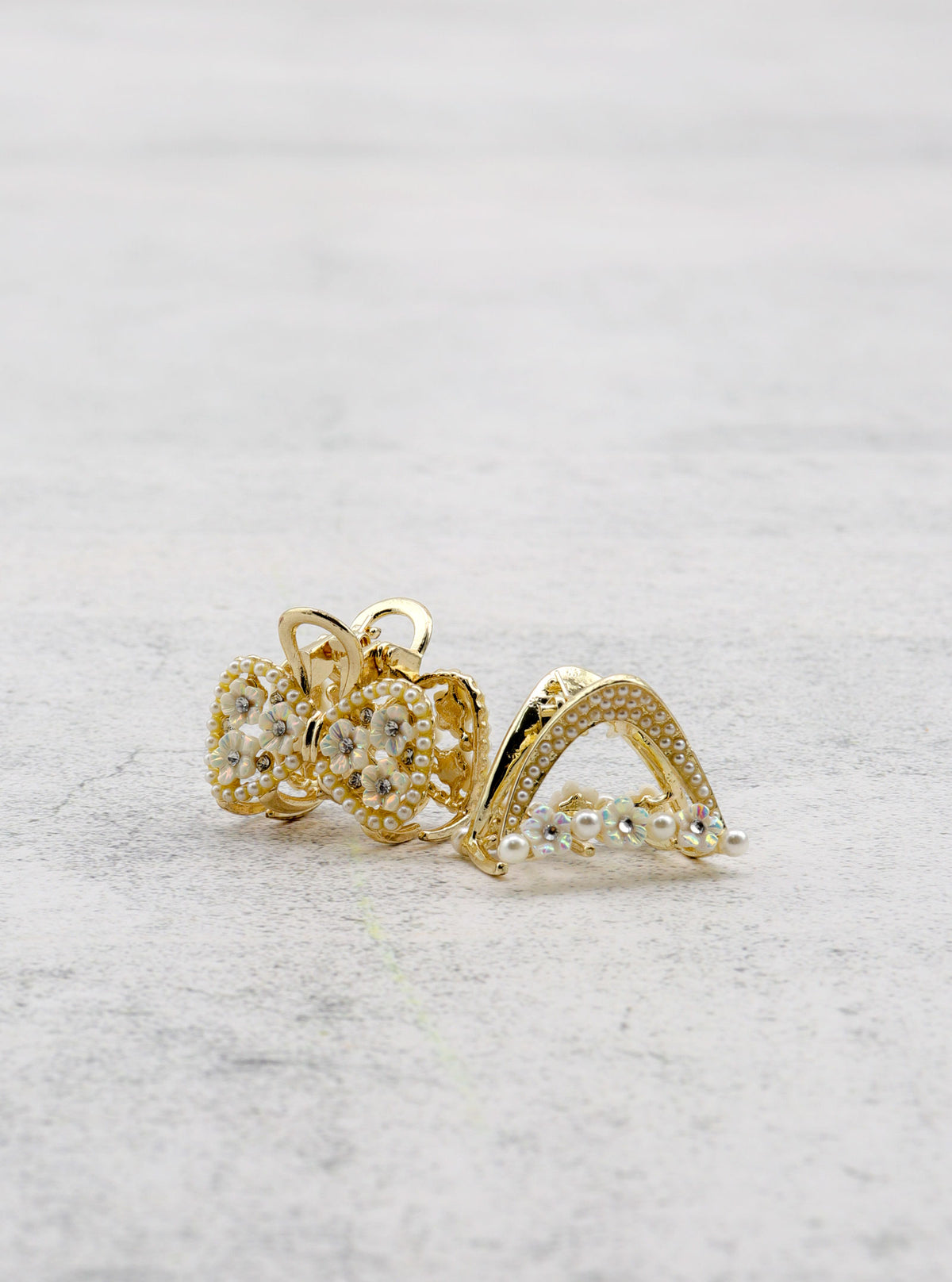Detail view of Jumi ribbon and triangle mini hair claw and clasp