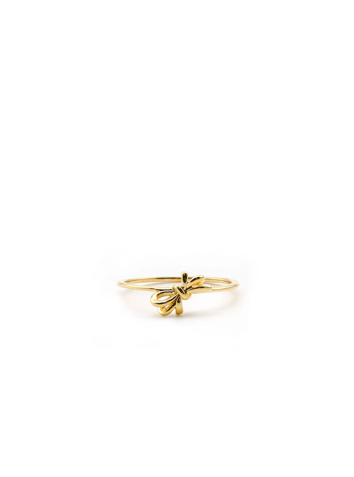 Gold Melandia bow ring on white background.