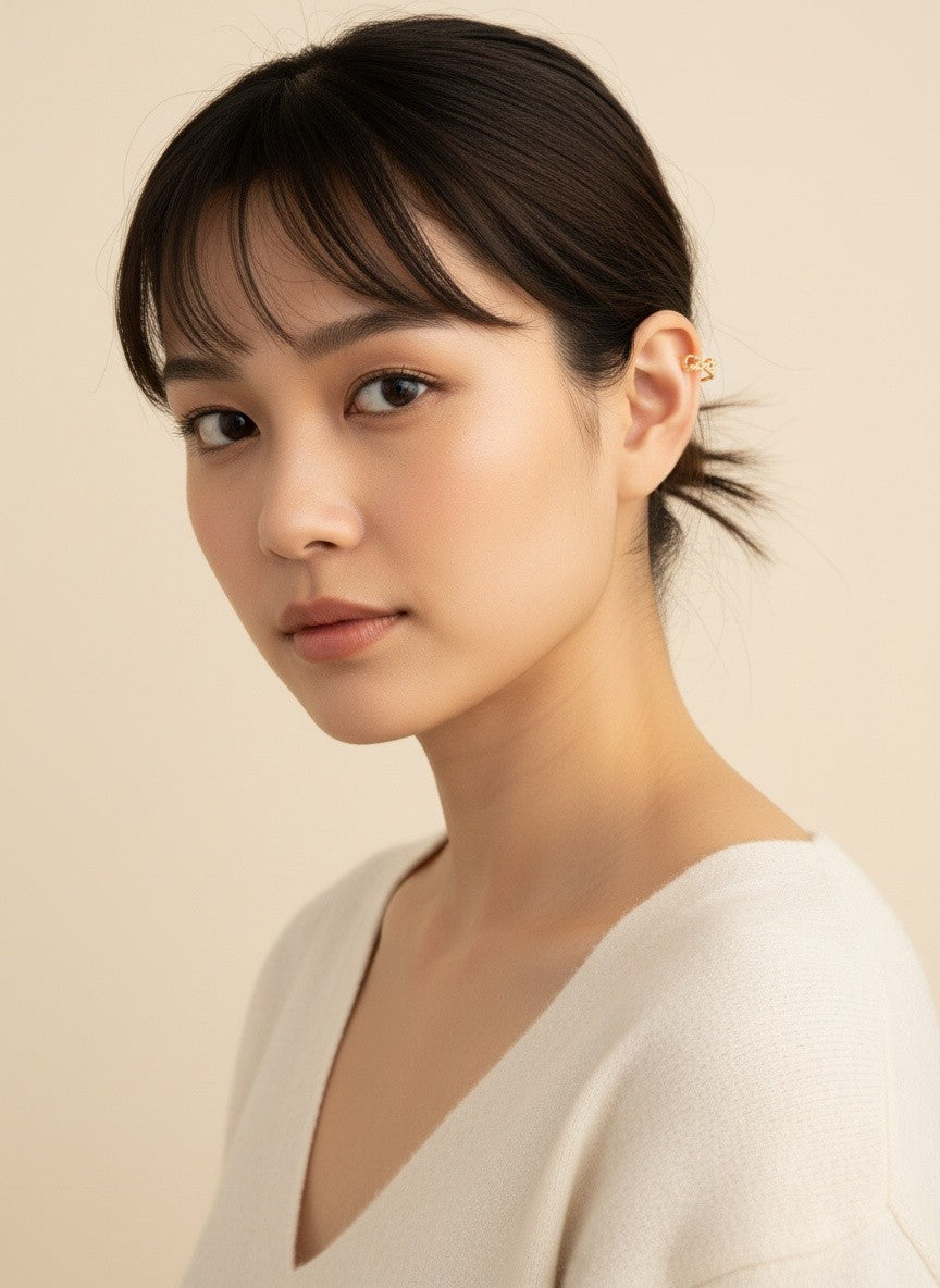 Model wearing Tanvi gold star ear cuff
