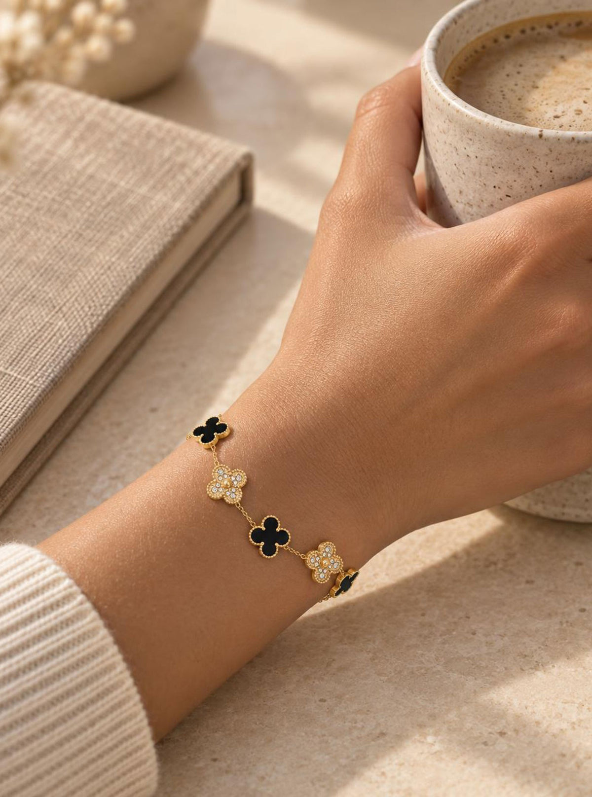 Model wearing Aanya Gold Black clover bracelet