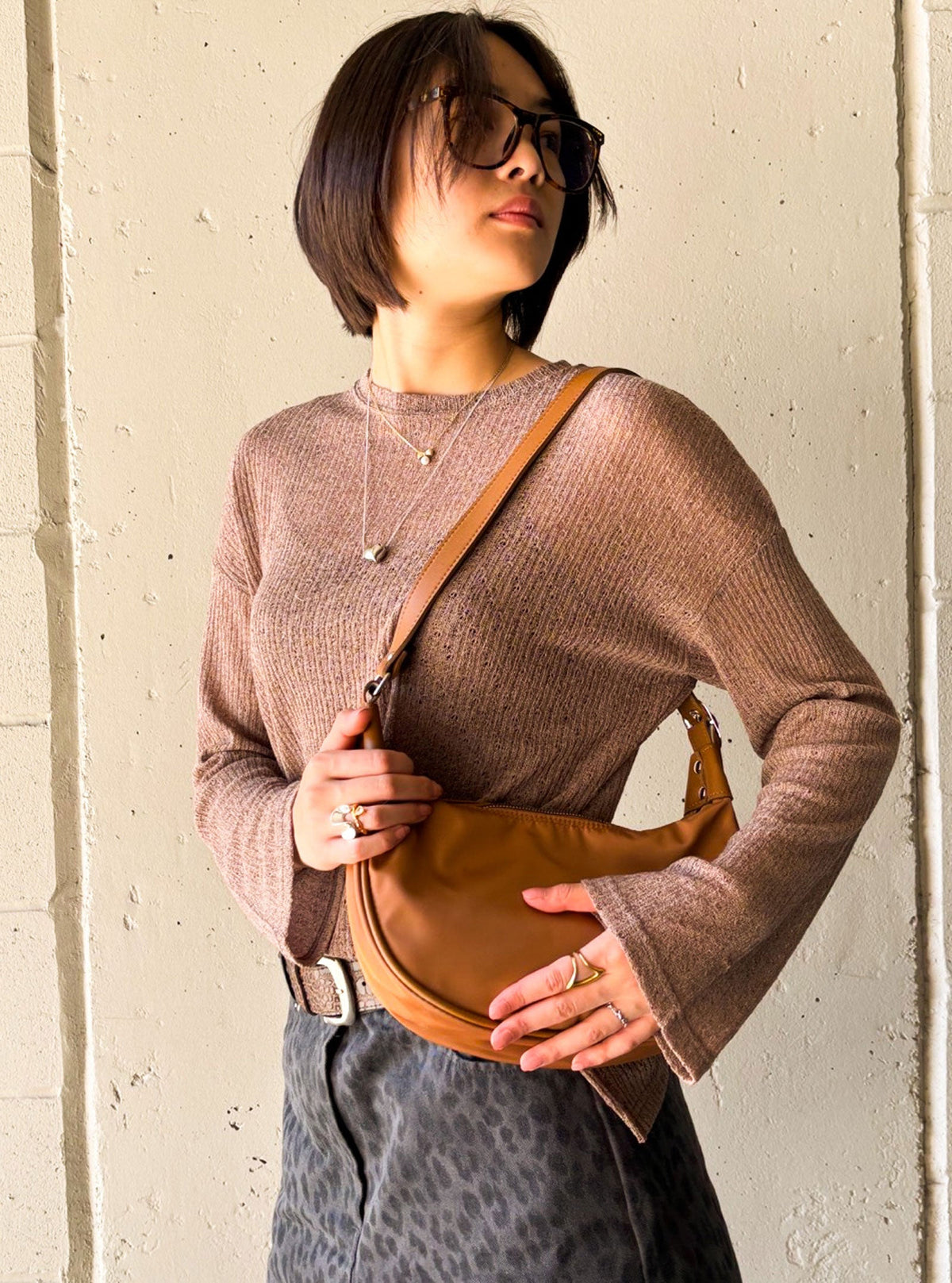 Bryd caramel shoulder bag styled on a model