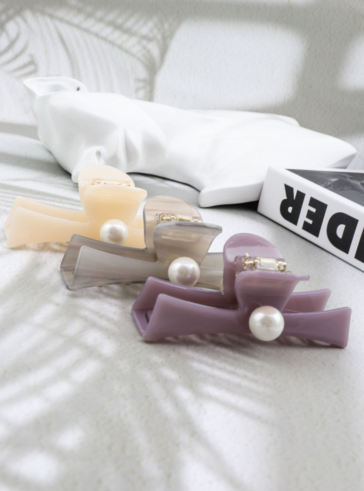 Jadelle hair claws in light purple, ivory and light gray