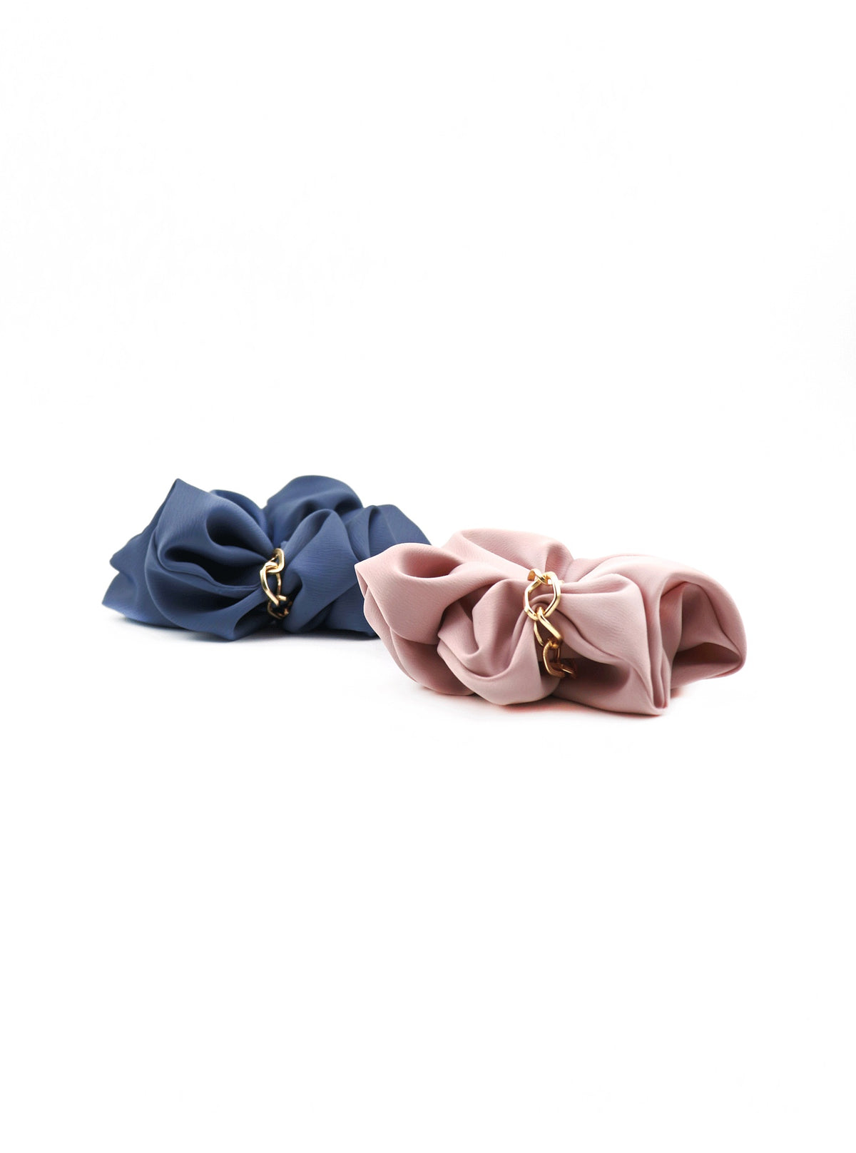 Detail view of Jerika scrunchies in Ocean and Pink