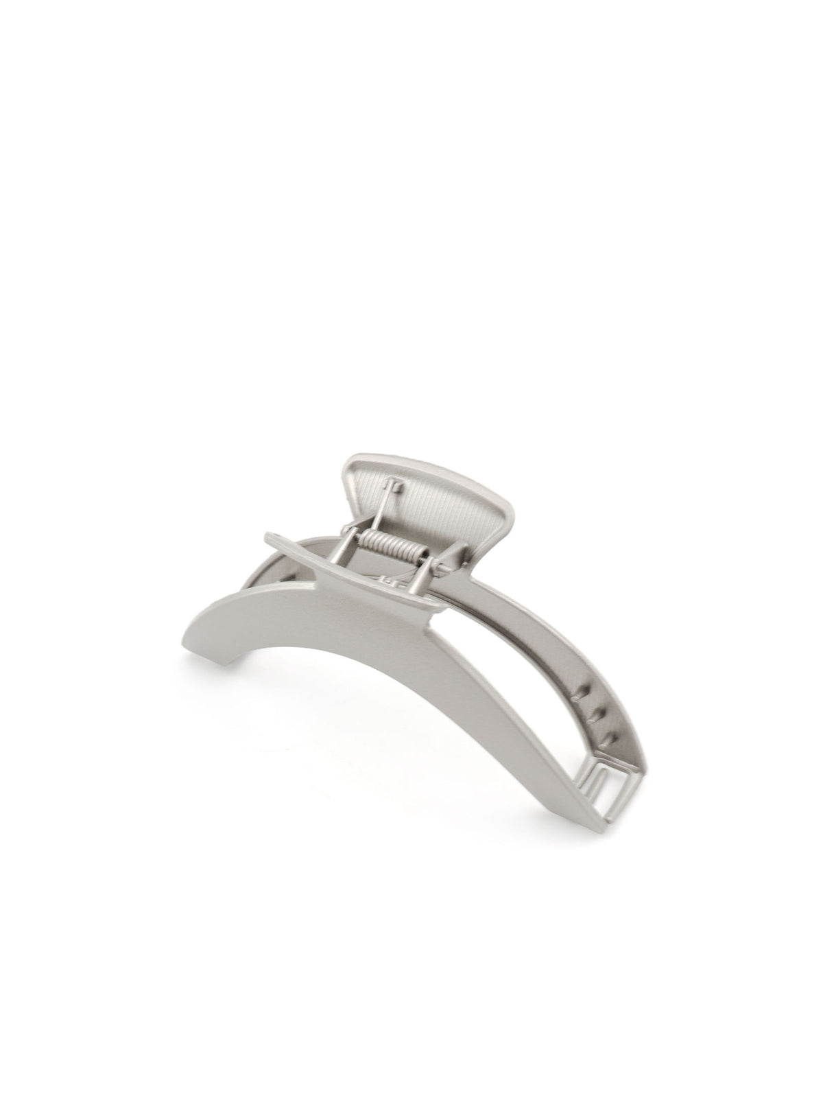 Top view of Jila matte silver hair claw and curved silhouette