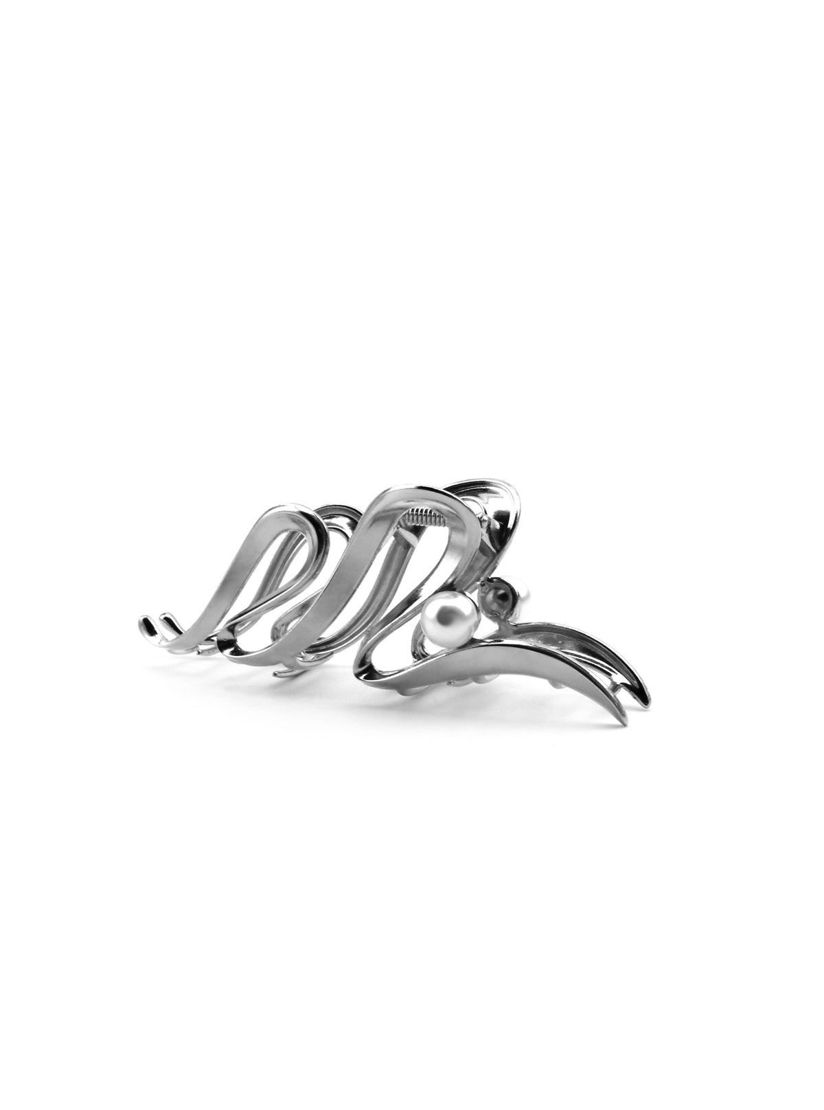 Side view of Juriko silver sculptural hair claw with pearl accent