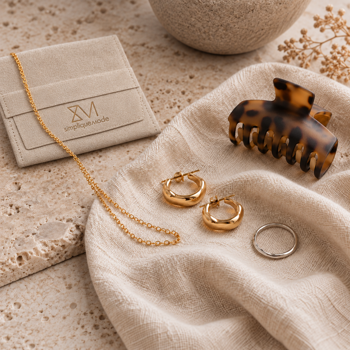 Natural lifestyle setting of Simplique Mode jewelry, hair accessory and gift bag.